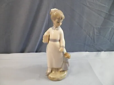 Zaphir Porcelain Figurine - Girl With Books & Baby Doll • $14.99