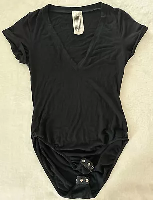 Size Small FREE PEOPLE Black Bodysuit Top Cap Sleeve Low Cut Deep V-Neck Women • $24.99