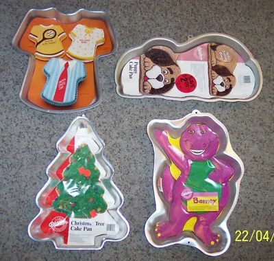 $12 • Buy (4) Wilton Cake Pans Barney/Christmas Tree/Puppy Dog/Tee Shirt
