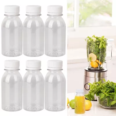 6/12/24pcs 4oz Clear Plastic Juice Bottles With Caps Mini Shot Containers Milk • £3.39