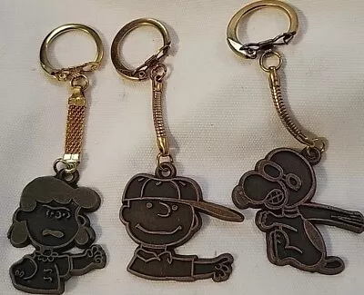 [3] Three Vintage PEANUTS Characters Keychains. LUCY~ CHARLIE BROWN ~ SNOOPY.   • $22