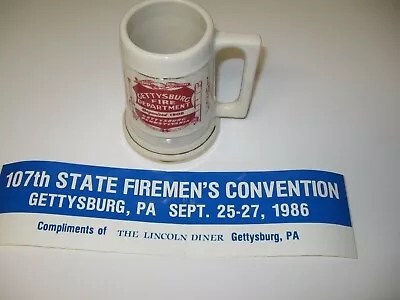 1975 Gettysburg Pa. Fire Dept. Mug +1986 107th St. Firemen's Convention Sticker • $22.50