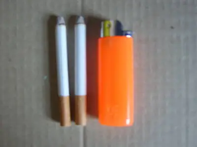 2 Fake Cigarettes And 1 Squirt Lighter. For Adults Only. Not For Children. • £4.99