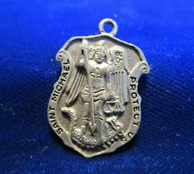 Vintage St Michael Protect Us Meda PEWTER Shaped Like Police Shield • $16.50