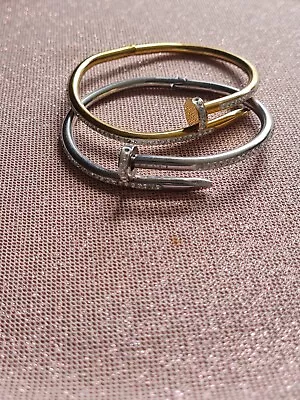 Nail Bracelets.Silver And Gold Gently Used.   • $27.88