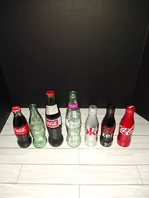 Coca Cola Bottles Lot Of 7 Glass & Aluminum Various Sizes & Conditions  • $4.99