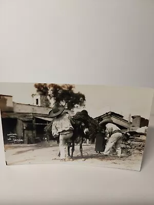 Vintage RPPC Mexican Men Loading A Donkey With Vegetation. • $3.50