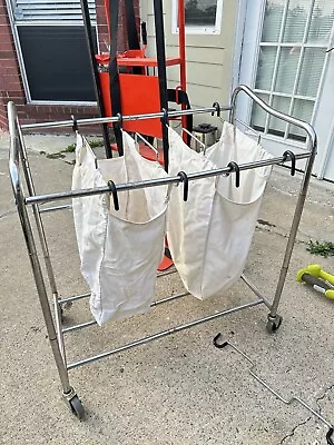 Cream Colored Garments Laundry On Wheel Cart • $30