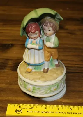 Ceramic Rotating Music Box 2 Kids And Umbrella Plays Raindrops Repaired • $6.76