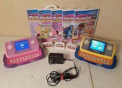 2 VTech MobiGo Touch Learning System Bundle W/ 8 Games And Adapter  • $90