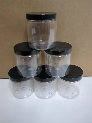 Six  8 Oz Clear Plastic Jars With Black Lids • $10.46