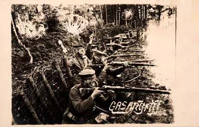 Featuring German Soldiers Firing From Trenches With Gas Masks Old Photo • $9