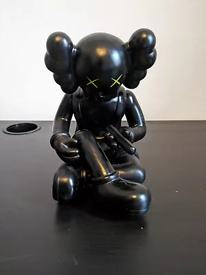 Kaws Black Siting • £30