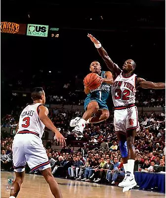 Muggsy Bogues Charlotte Hornets Unsigned Teal Jersey Mid-Air Vs Knicks Photo • $39.99