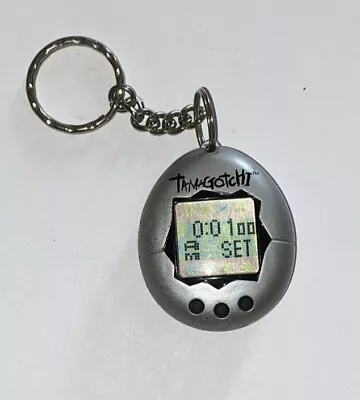 Vintage Bandai Tamagotchi 1997 Silver  Virtual Keychain Pet WORKS • $19.99