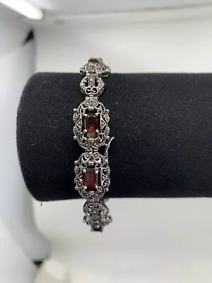 Sterling Silver Garnet And Marcasite Scrollwork Tennis Bracelet  • $64