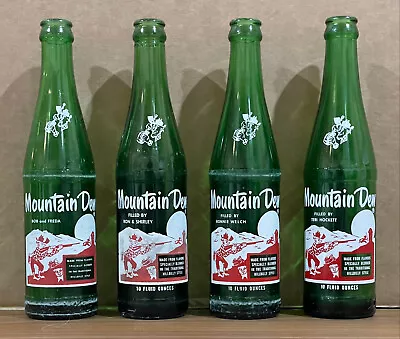 Lot Of 4 Vintage Mountain Dew Bottles W/ Unique Names Under The Word “Mountain” • $33