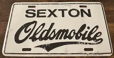 Sexton Oldsmobile Dealership Booster License Plate Lansing Michigan • $39.99