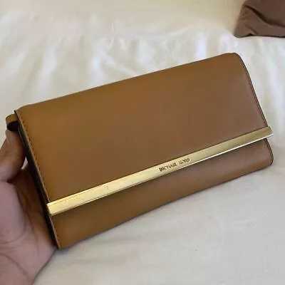 Michael Kors Clutch • $75