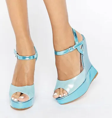 £65 • Buy Terry De Hallivand Electra Blue Glitter Wedge Sandals