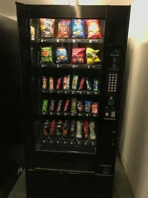 Narrow Used Polyvend 32 Selection Snack Can & Bottle Combi Vending Machine  • £1200