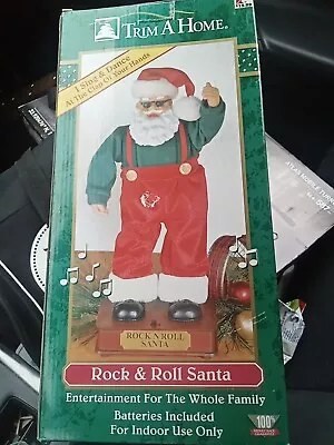 Christmas  13  MOTION ROCK & ROLL SANTA • $99