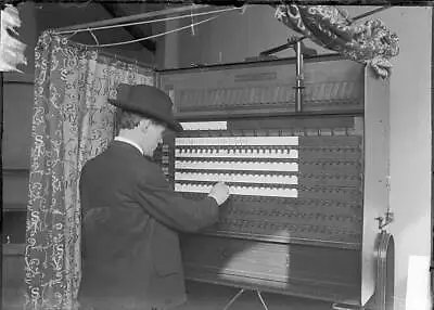 Man Standing In A Voting Machine With Its Curtains Pulled Back To - Old Photo • $5.55