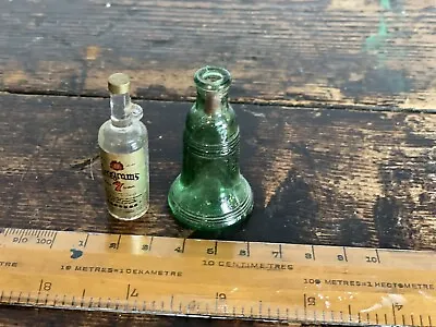 2 Miniture Bottles Green Is Glass Clear Is Plastic  • £2