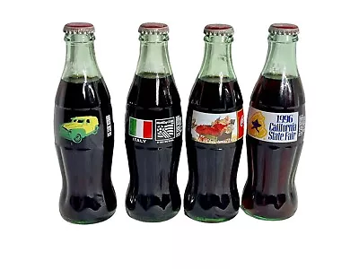Vintage Lot Of 4 Commemorative Coca Cola Bottles Unopened Collectible  • $30