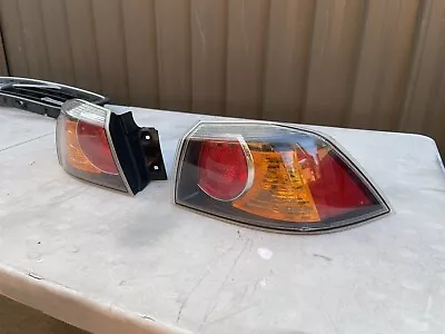 Mitsubishi Lancer STOCK Tail Lights REAR QUARTER SECTION L & R • $120