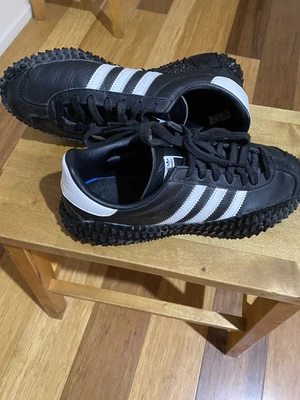 $60 • Buy Adidas ‘Kamanda Country’ Black Sneakers Adidas Originals Hype Footlocker