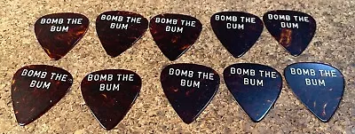 10 D'ANDREA VINTAGE AD LIB GUITAR PICKS  BOMB THE BUM  1960s ERA TORT CELLULOID • $14.99