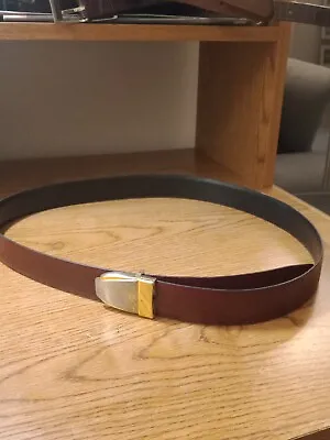 Vintage YVES SAINT LAURENT BLACK AND BROWN REVERSIBLE BELT 43  Length  • $45