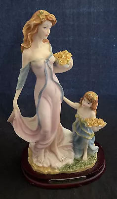 Montefiori Collection Figurine. Mother With Daughter Holding Flowers. • $19.99