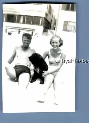 Found B&w Photo D_9917 Man And Pretty Woman In Swimsuits Sitting On Beachdog • $6.98