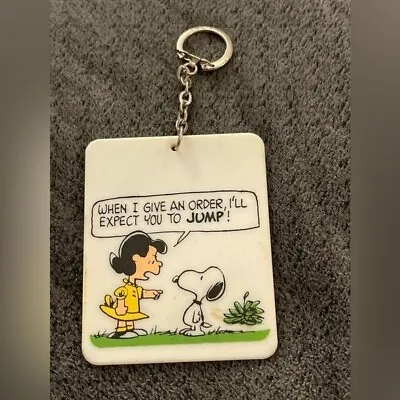 Vintage Flip Over Plastic Peanuts Keychain Snoopy Lucy Charlie Brown B50 • $10