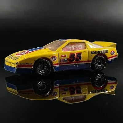 Matchbox Pontiac Firebird Racer Diecast Car STP Son Of A Gun 1985 1:64 Yellow 55 • $3.99