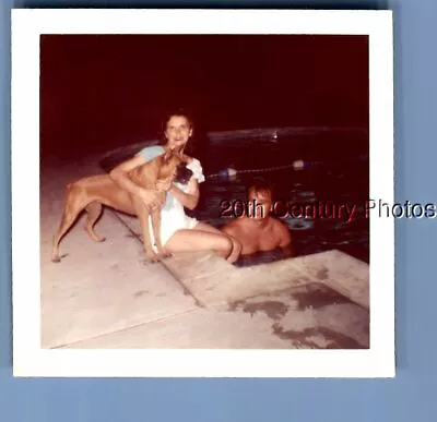 Found Color Photo L_3713 Pretty Woman Sitting By Man In Pooldog • $6.98