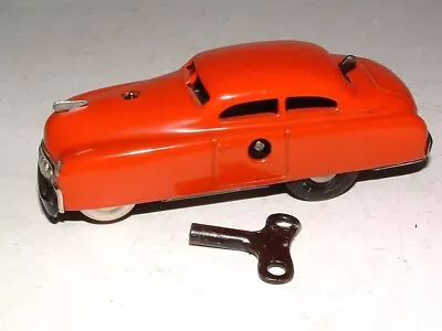 * 1960s SCHUCO VARIANTO-LIMO TIN WIND-UP RED TOY CAR 4 1/4  LONG W/KEY WORKS ! • $23.50