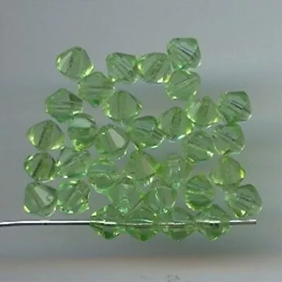 50 VINTAGE GLASS PERIDOT 6mm. FACETED BI-CONE BEADS 402 • $1.49