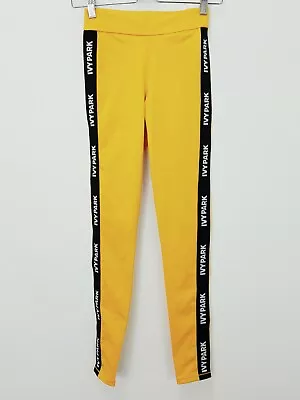 $55 • Buy IVY PARK | Womens Elastic Logo Mid Rise Leggings In Old Gold [ Size S Or AU 10 ]