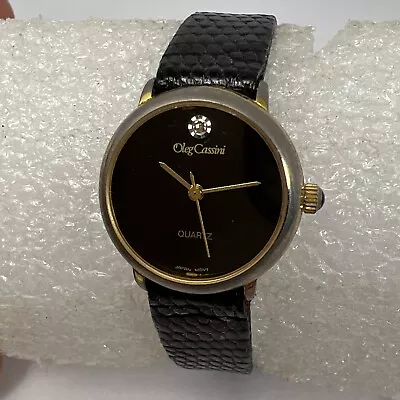 Vintage Oleg Cassini Ladies Gold Tone Watch W/Diamond & Black Leather Strap • $14.99