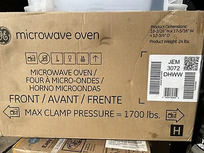 0.7 Cu. Ft. Spacemaker Countertop Microwave Oven In White • $150