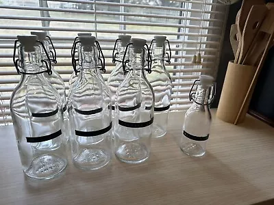 Ikea Korken Glass Bottle 8 Piece SET  Metal Locking Cork Lid Clear Tall EUC • $49.99