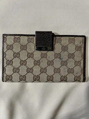$65 • Buy Gucci Canvas Checkbook Holder