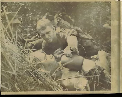 1966 Press Photo Vietnam War US Marine Offers Water To A Wounded Comrade • $9