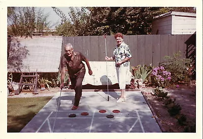 Vintage Photograph Couple Playing Shuffleboard Game Sport Kodak 1964 • $39.99