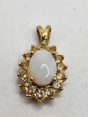 Vintage Gold Tone Metal Faux Opal And Clear Rhinestone Oval Pendant • $23