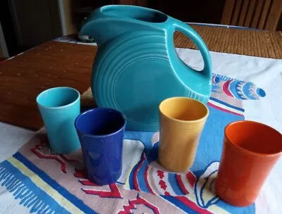 VTG Fiestaware Turquoise Disc Juice Water Pitcher And 4 Juice Glasses  • $30