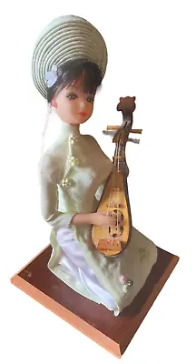 Vintage Vietnamese Doll Playing Musical Instrument On Wooden Base  • $50.83